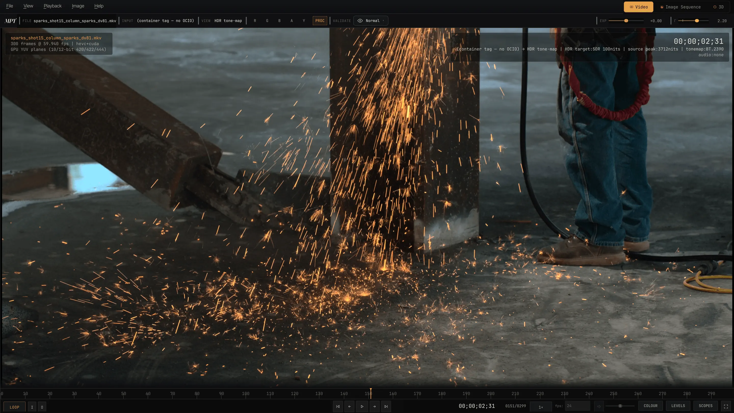 A Dolby Vision frame of welding sparks showering down a steel column, playing in MPT with the source peak brightness of 3712 nits shown.